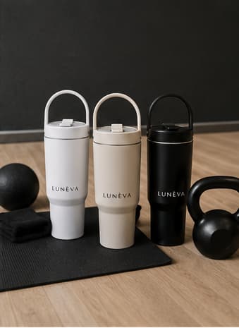 Three LUNÉVA bottles on a pilates mat